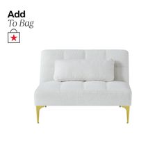 a white couch sitting on top of a wooden floor