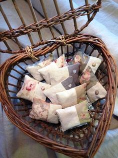 a basket filled with lots of different types of items on top of a table next to a white towel