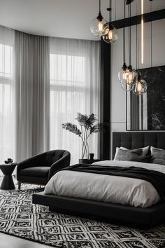 a black and white bedroom with modern decor