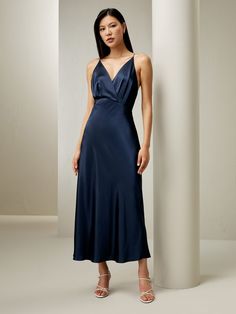 Make heads turn in this elegant silhouette. Rendered in a stunning blue hue, this maxi-length dress draws attention with its striking open low back that finishes with a feather pendant. This statement style can be perfectly paired with neutral heels. When hunting for the perfect party dress, sometimes the simpler (and silkier!), the better. Especially during the holiday season, when it might be tempting to wear your most out-there pieces, consider a silk dress for its timeless appeal and effortless festivity. Affordable Blue Evening Midi Dress, Lily Silk, Women Silk Dress, Dress Drawing, Halter Midi Dress, Silk Maxi, Dressy Dresses, Feather Pendant, Silk Maxi Dress