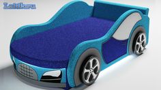 a blue car shaped bed with wheels on the bottom and sides, sitting in front of a white background