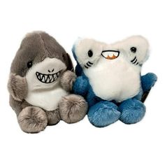 two stuffed animals sitting next to each other