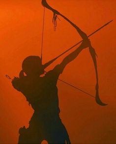 the silhouette of a person holding a bow and arrow in front of an orange sky