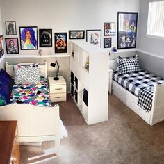 a bedroom with a bed, desk and pictures on the wall next to each other