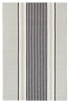 a black and white striped rug on a white background, with vertical stripes in the middle