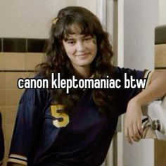 a woman standing in front of a bathroom sink with the caption canon kleptomaniac btw