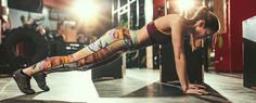 a woman doing push ups in a gym