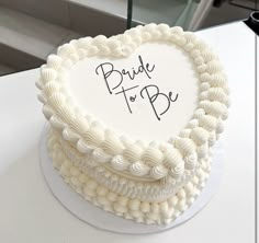 a heart shaped cake with the words bride to be written on it's side