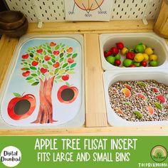 two trays filled with food on top of a wooden table next to a sign that says apple tree insertt fits large and small bins