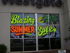 a store front with the words blazing summer sale painted on it's glass windows