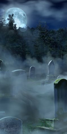 a cemetery with fog in the foreground and a full moon in the sky above it