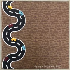 a paper cut out of a road with cars driving on it and the word race written in