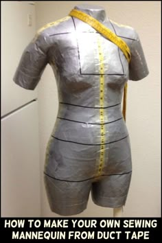 a mannequin with yellow tape on it's body