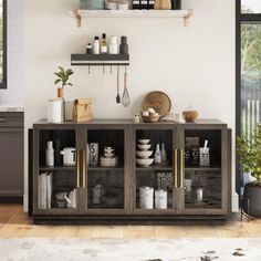 a kitchen with open shelves filled with dishes and utensils