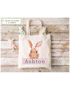 a white bag with an image of a bunny on it and the words ashton written in pink