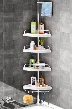 a corner shower shelf in a bathroom next to a bathtub