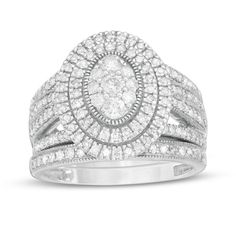 Give her a stunning symbol of your love with this vintage-inspired diamond bridal set. Fashioned in cool 10K white gold, the outstanding engagement ring features an oval-shaped composite of diamonds - the largest a 1/10 ct. stone - wrapped in double frame of diamonds and intricate milgrain. The split multi-row shank shimmers with diamonds and milgrain borders. Seal your vows with the coordinating diamond- and milgrain-lined wedding band. Captivating with 1-1/4 cts. t.w. of diamonds and a bright Center Stone Engagement Ring, Big Wedding Rings, Double Frame, Peoples Jewellers, Bridal Engagement Rings, Diamond Bridal Sets, Stone Wrapping, Rings Vintage, Wedding Rings Vintage