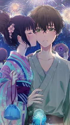 two people in kimonos kissing each other with fireworks in the sky behind them