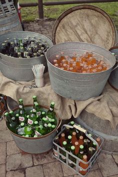 several buckets filled with different types of food