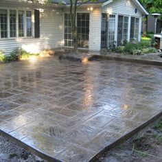 an outdoor patio that has been cleaned and is surrounded by trees