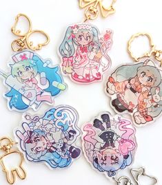 six key chains with cartoon characters on them