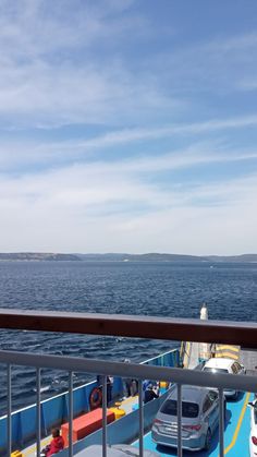 cars are parked on the deck of a ferry