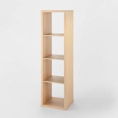 an empty wooden shelf against a white background