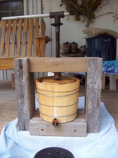 a wooden bucket sitting on top of a table