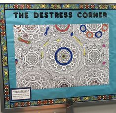 the poster is on display in front of a blue background with black and white designs