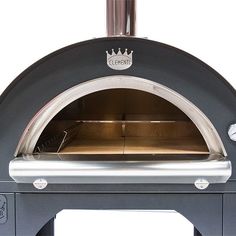 an outdoor oven with the door open to show it's wood burning and grilling