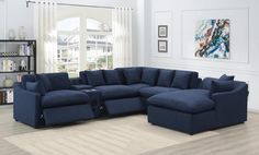 a living room with blue furniture and white walls