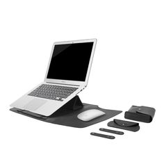 an open laptop computer sitting on top of a desk next to mouse and keyboard pad