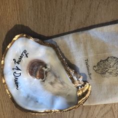 an oyster shell with writing on it