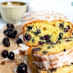 a loaf of lemon blueberry bread on a cutting board