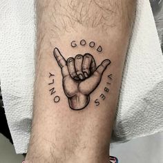 a black and white photo of a person's foot with a tattoo on it