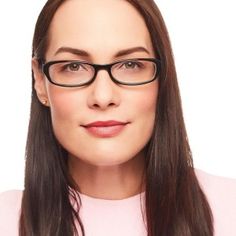 a woman with long hair wearing glasses