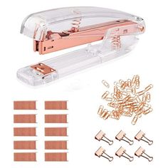 a stapler with lots of clips in it and some paper clips next to it