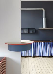 a kitchen with blue and white stripes on the counter