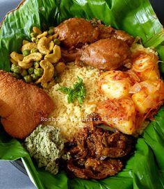 a close up of a plate of food with rice and meats on the side