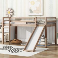 a wooden bunk bed with a slide on the bottom