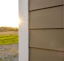 the sun is shining brightly through an open window on a house's sidings