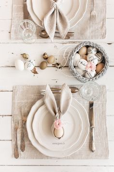 an easter table setting with eggs and napkins