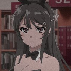 an anime character with long hair wearing a bow tie in front of bookshelves