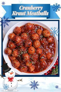 a bowl filled with meatballs covered in gravy next to a snowman