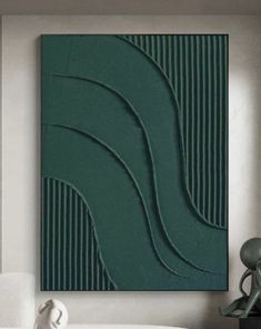 an abstract painting on the wall in a living room with white furniture and green accents