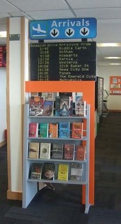 an orange and white book shelf with several books on it