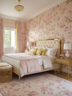 a bedroom decorated in pink and gold with floral wallpaper