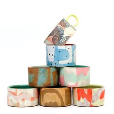 several rolls of washi tape stacked on top of each other in different colors and patterns