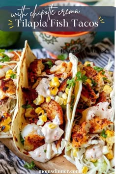 three fish tacos on a wooden cutting board