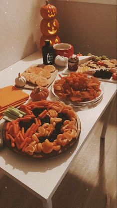 Jack-o-lantern shaped veggie tray, orange snack tray, spiderweb and pumpkin shaped sugar cookies, and a spooky cheeseboard Nostalgic Halloween Party, Spooky Birthday Ideas, Summerween Ideas Aesthetic, Summer Halloween Party Food, Halloween Pool Party Ideas, Summerween Movie Night, Summer Ween Food, Summerween Snacks, Summerween Decorations